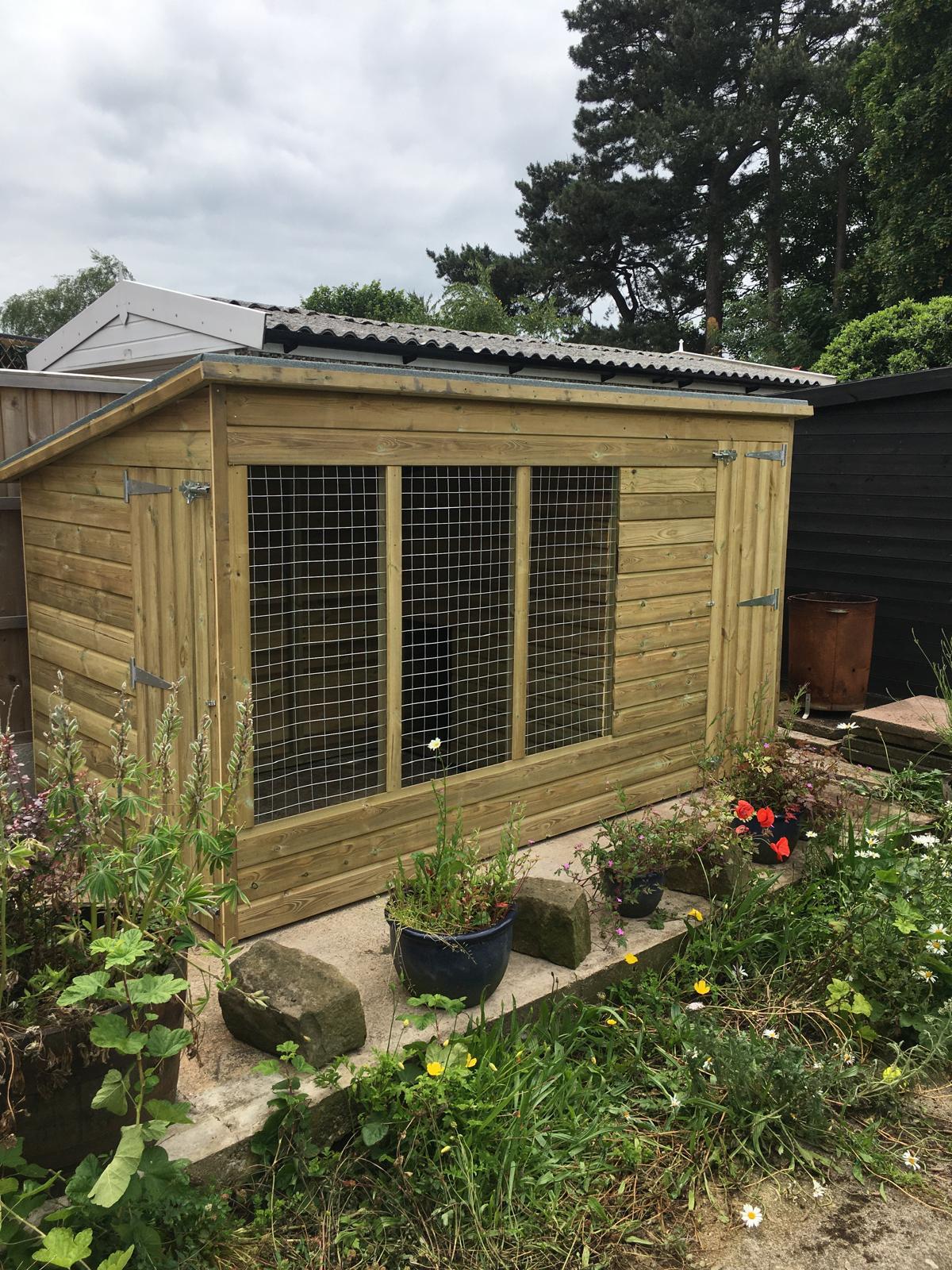 wooden dog kennel and run