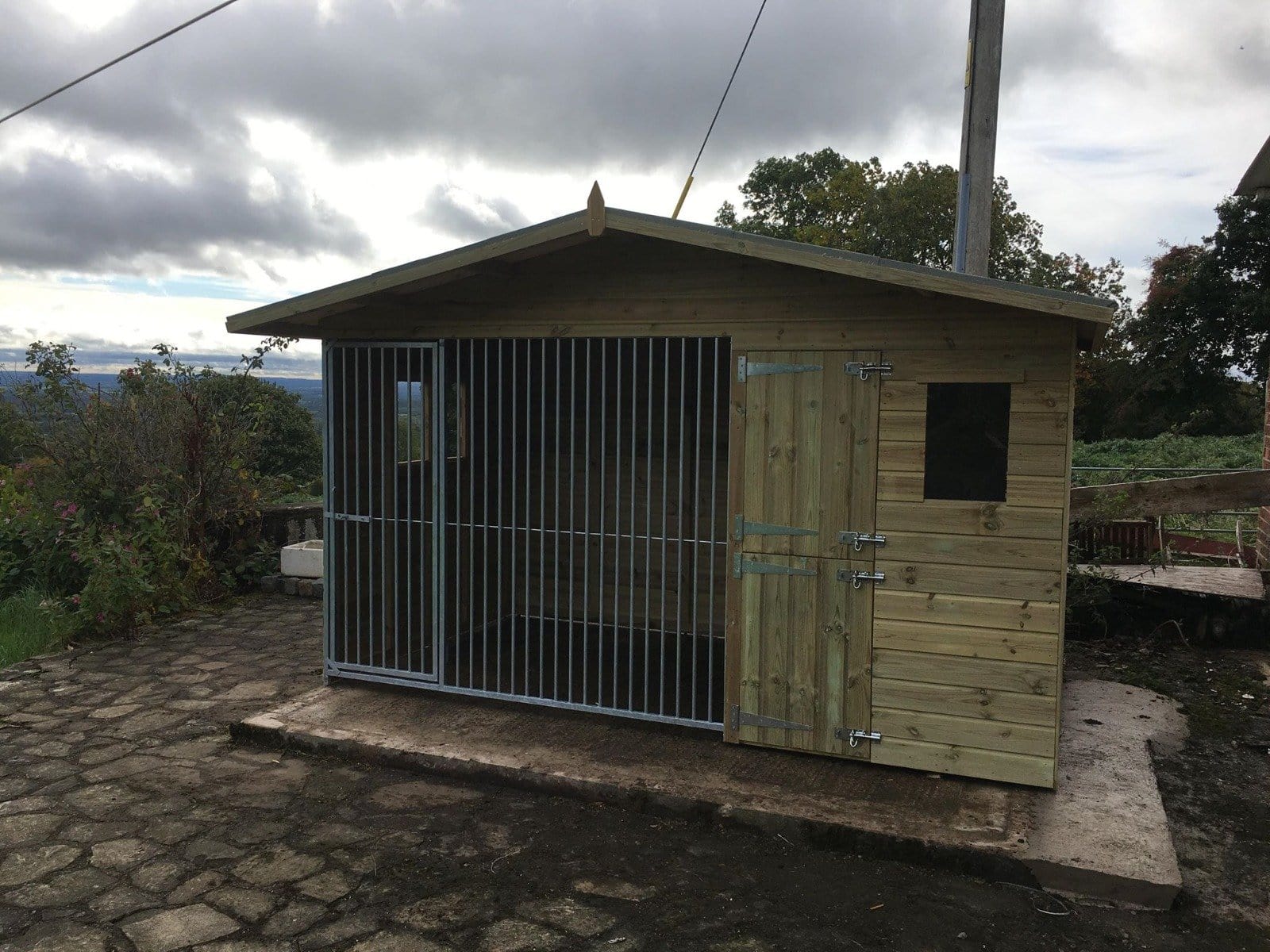 wooden dog kennel and run