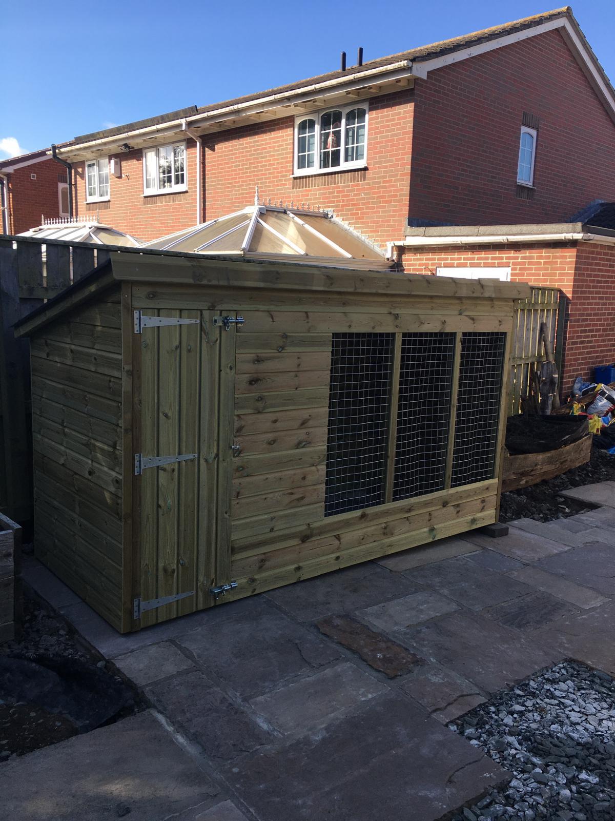 wooden dog kennel and run