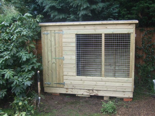 wooden dog kennel and run