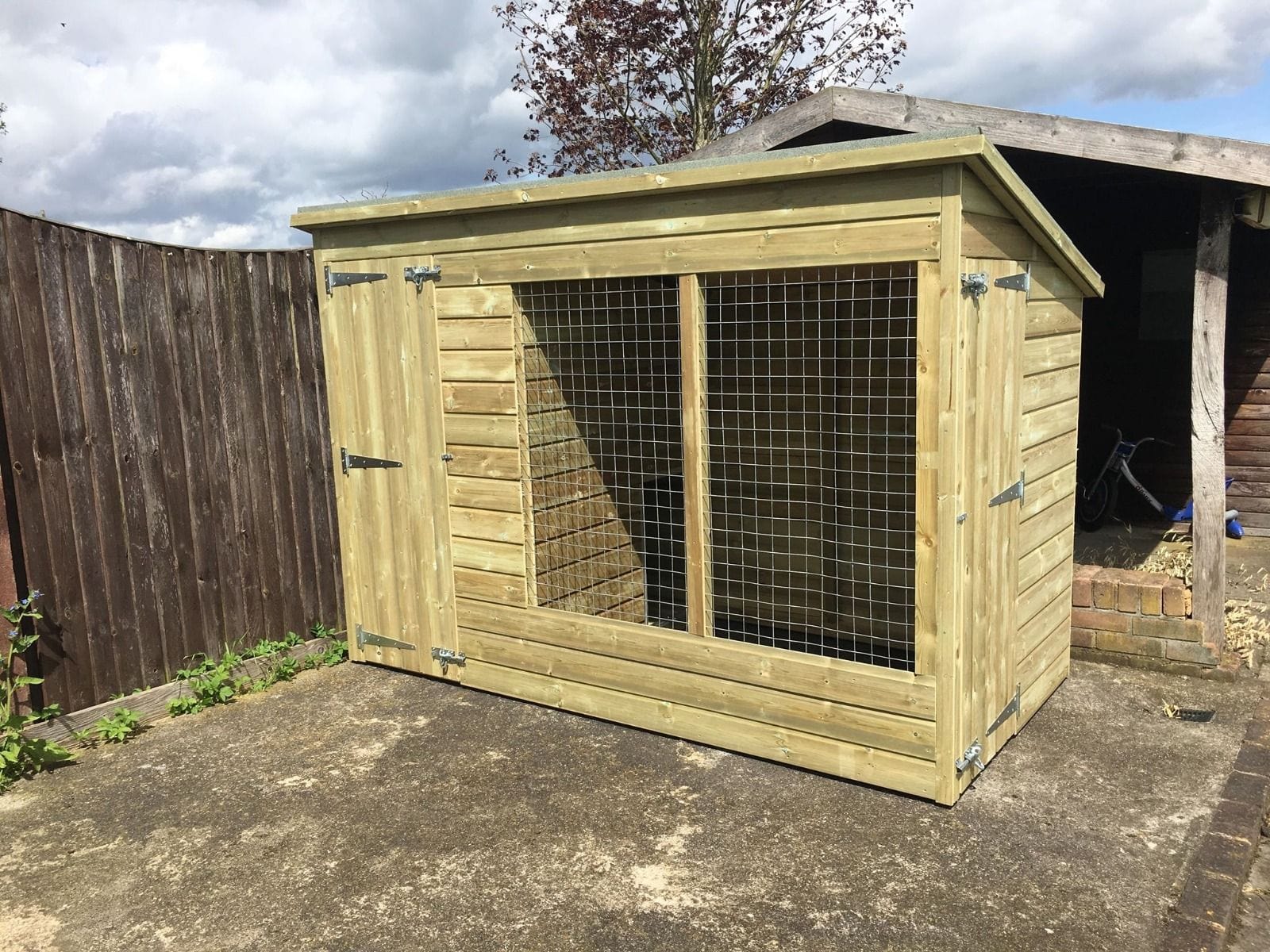 wooden dog kennel and run