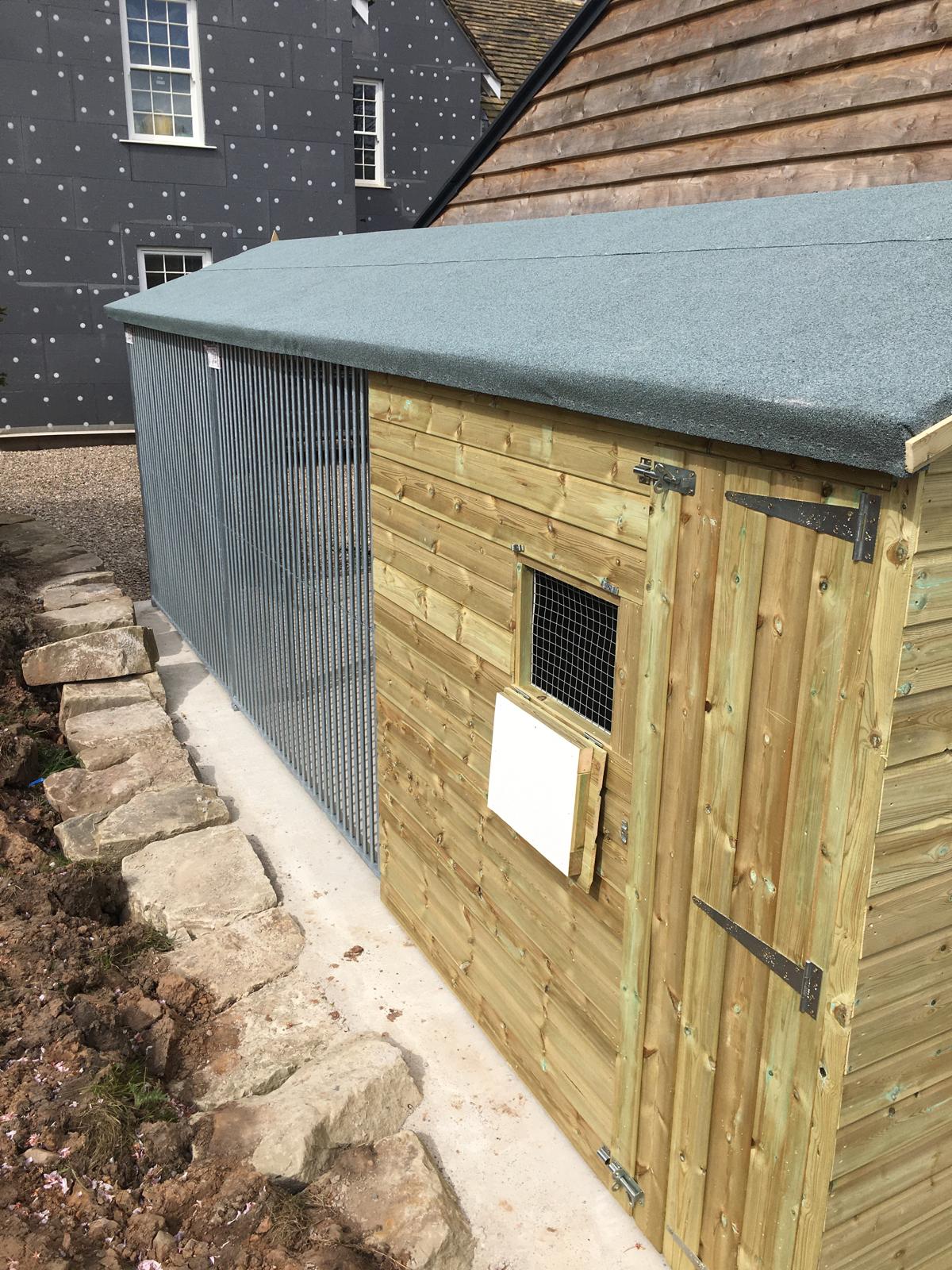 wooden dog kennel and run