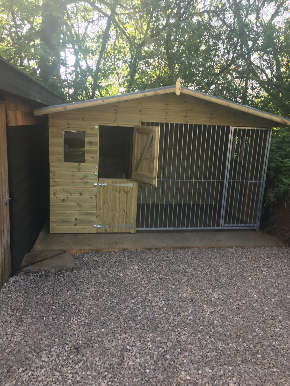 wooden dog kennel and run